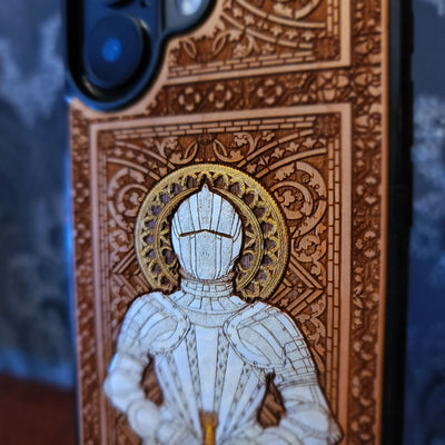 Laser engraved and hand painted wooden phone case featuring a medieval knight in silver armor holding a sword for iPhone and Samsung Galaxy models.