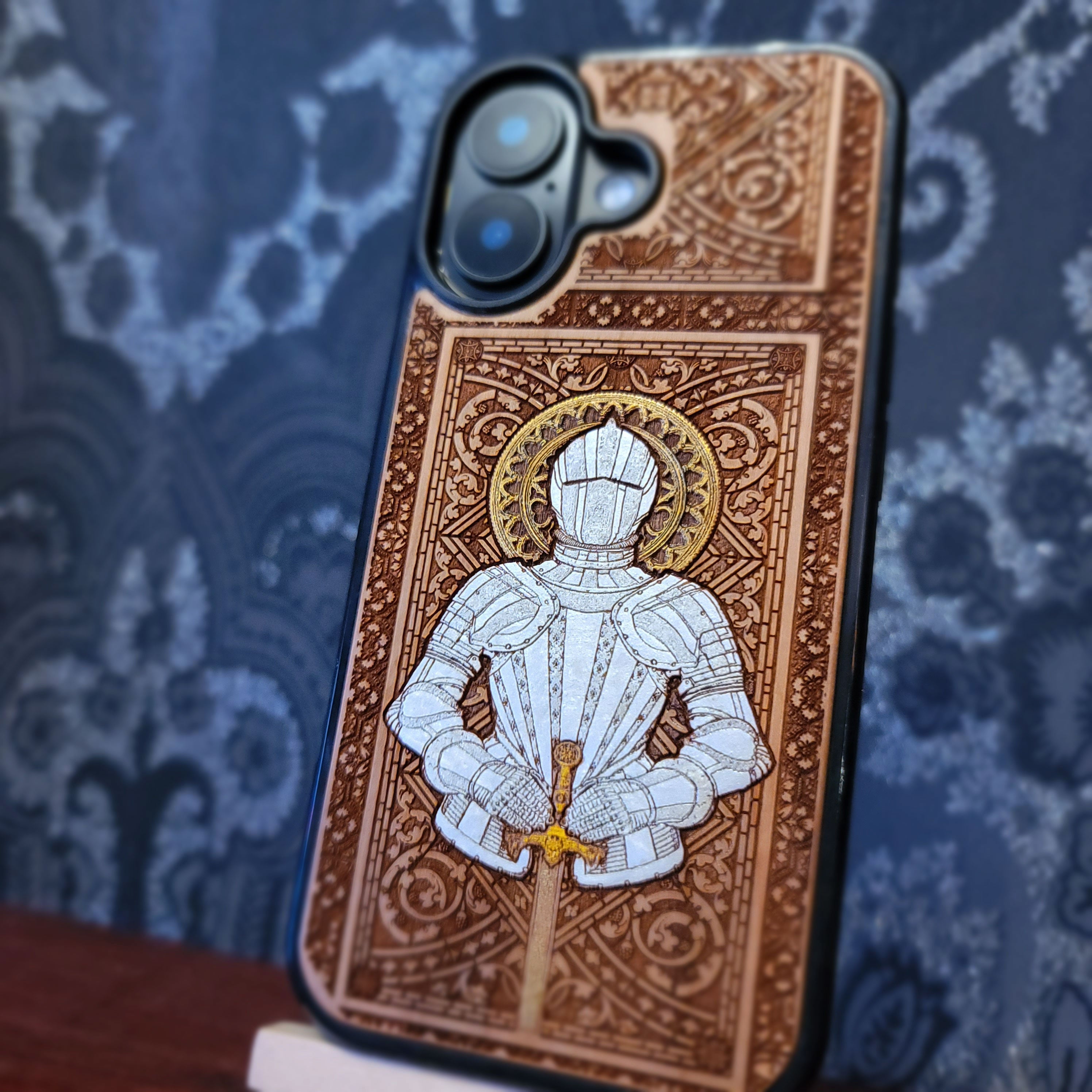 Laser engraved and hand painted wooden phone case featuring a medieval knight in silver armor holding a sword for iPhone and Samsung Galaxy models.