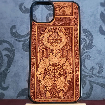 A wooden phone case with a black bumper edge, featuring an intricate laser-engraved illustration of a crowned warrior in armor,
