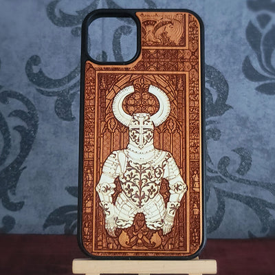 A wooden phone case featuring a detailed laser-engraved illustration of a horned knight in armor,