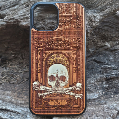 Hand-painted Memento Mori wooden phone case featuring a laser-engraved skull and bones design on cherrywood. Compatible with iPhone -11 Pro Max and Galaxy S-S20.