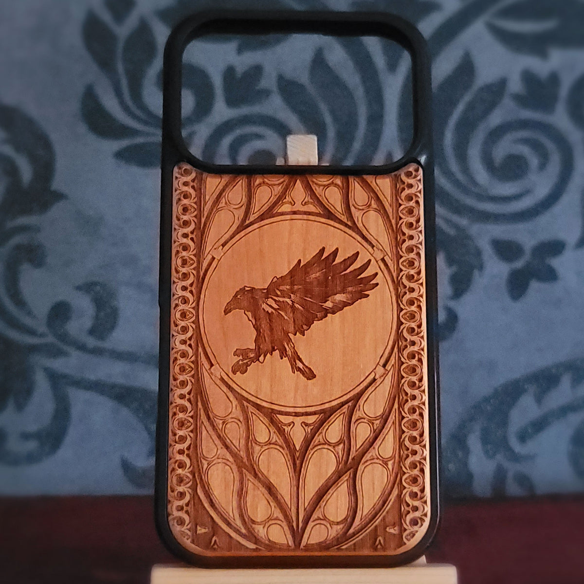 Raven laser engraved on real cherrywood phone case with gothic ornamental frame