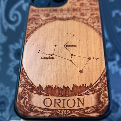 laser engraved wooden phone case featuring the Orion constellation with celestial star details on natural wood for iPhone and Samsung Galaxy models.