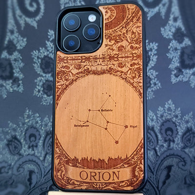 laser engraved wooden phone case featuring the Orion constellation with celestial star details on natural wood for iPhone and Samsung Galaxy models.
