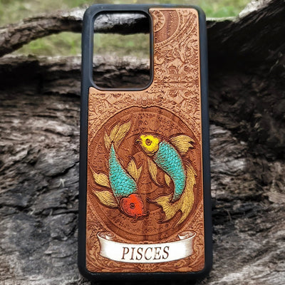 Pisces zodiac wood phone case with engraved celestial fish design