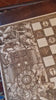 Handcrafted chessboard with detailed Saint Michael religious engravings