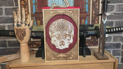 Gothic-style wood-carved skull wall art