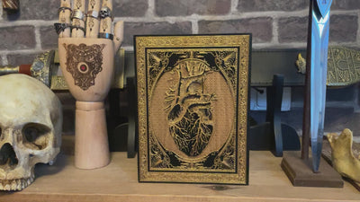 Elegant black and gold anatomical heart wood art, perfect for unique gothic-themed gifts.