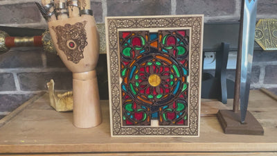 Decorative medieval-style wood panel with gothic floral stained glass look.
