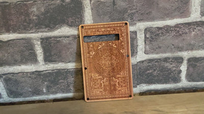 Hand-finished Stratocaster tremolo cover in cherry wood with intricate laser detailing