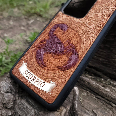Handmade Scorpio horoscope phone cover on natural wood