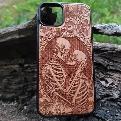 Gothic skeleton couple kissing engraved on a wooden phone case, compatible with iPhone  and Samsung Galaxy S.