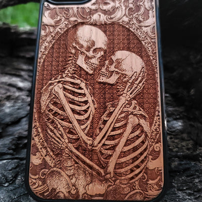 Gothic skeleton couple kissing engraved on a wooden phone case, compatible with iPhone  and Samsung Galaxy S.