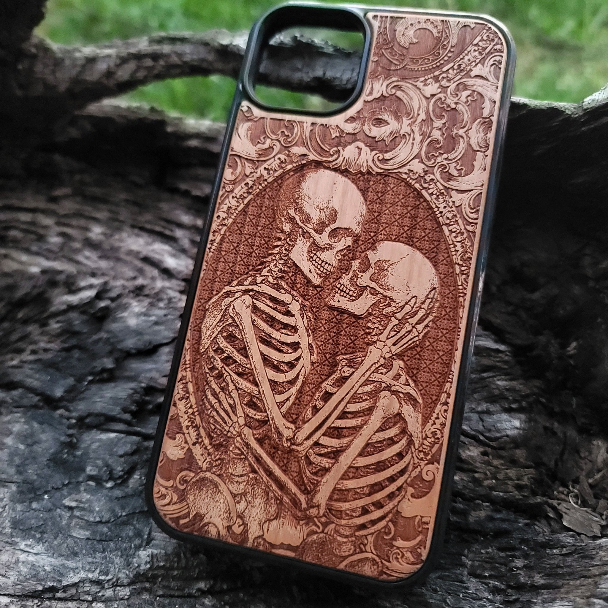 Gothic skeleton couple kissing engraved on a wooden phone case, compatible with iPhone  and Samsung Galaxy S.