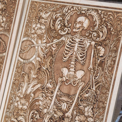 Skeleton couple in love, engraved on wood for spooky home decor.
