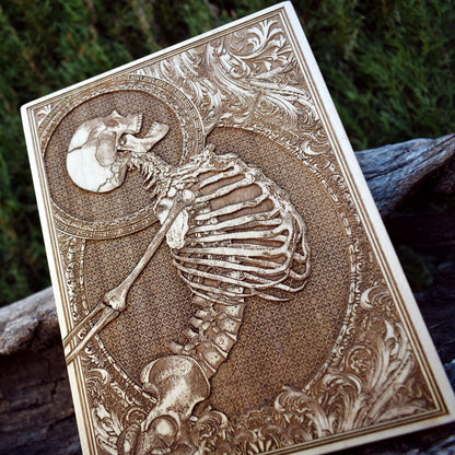 Dark aesthetic wood engraving - detailed skull design on premium wood