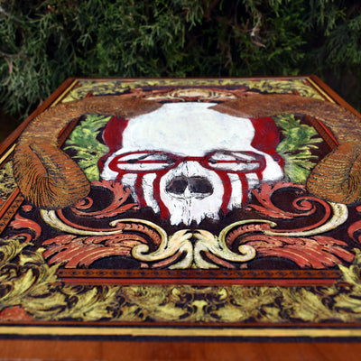 Dark skull-themed wood wall art, a perfect alternative home decor piece.