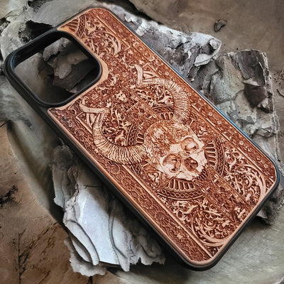 Gothic wooden phone case featuring an intricate skull and horns design. Handcrafted for iPhone  and Galaxy S, perfect for lovers of gothic art and unique phone accessories.