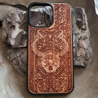 Gothic wooden phone case featuring an intricate skull and horns design. Handcrafted for iPhone  and Galaxy S, perfect for lovers of gothic art and unique phone accessories.