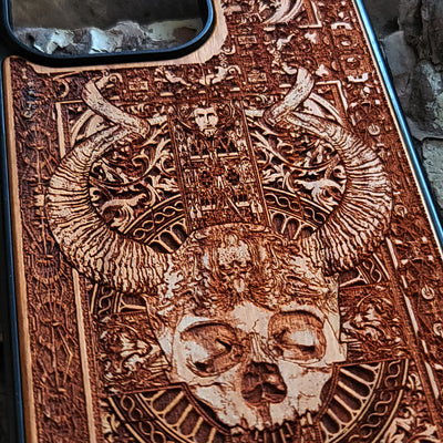 Gothic wooden phone case featuring an intricate skull and horns design. Handcrafted for iPhone  and Galaxy S, perfect for lovers of gothic art and unique phone accessories.