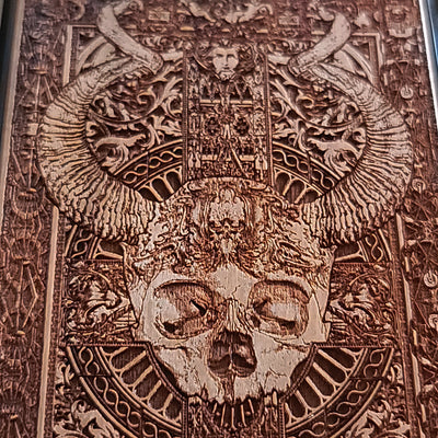 Gothic wooden phone case featuring an intricate skull and horns design. Handcrafted for iPhone  and Galaxy S, perfect for lovers of gothic art and unique phone accessories.