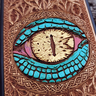 Handcrafted cherry wood phone case with bold Gothic Snake Eye engraving for iPhone & Samsung Galaxy users.