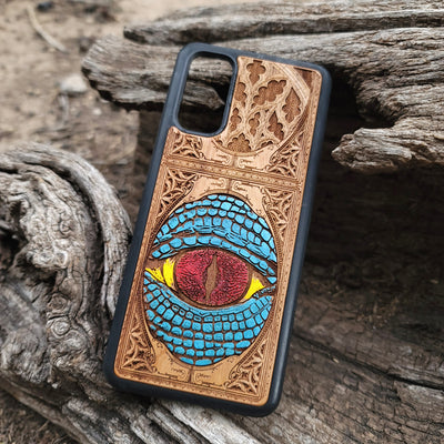 Snake eye gothic artwork engraved on a wooden phone case, compatible with iPhone  and Samsung Galaxy S.