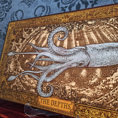 Hand painted and laser engraved wooden squid wall art in a nautical ocean style, featuring detailed marine-inspired design perfect for coastal and underwater themed home decor.