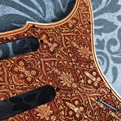 Natural wood Stratocaster pickguard with custom engraved design