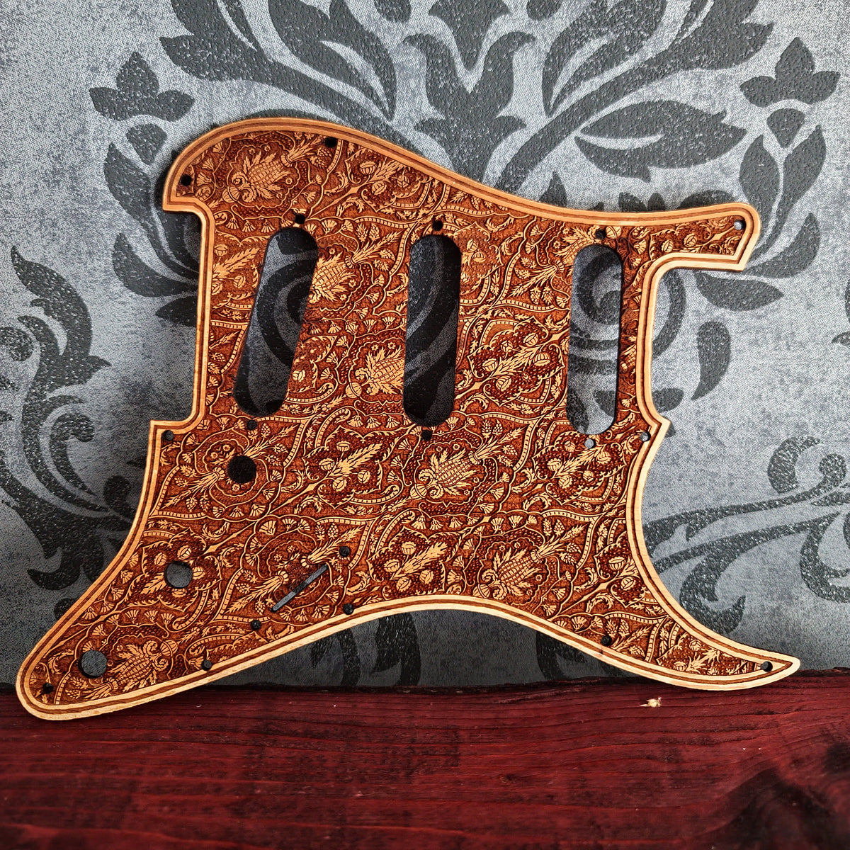 Custom wood Stratocaster pickguard with precision laser engraved artwork