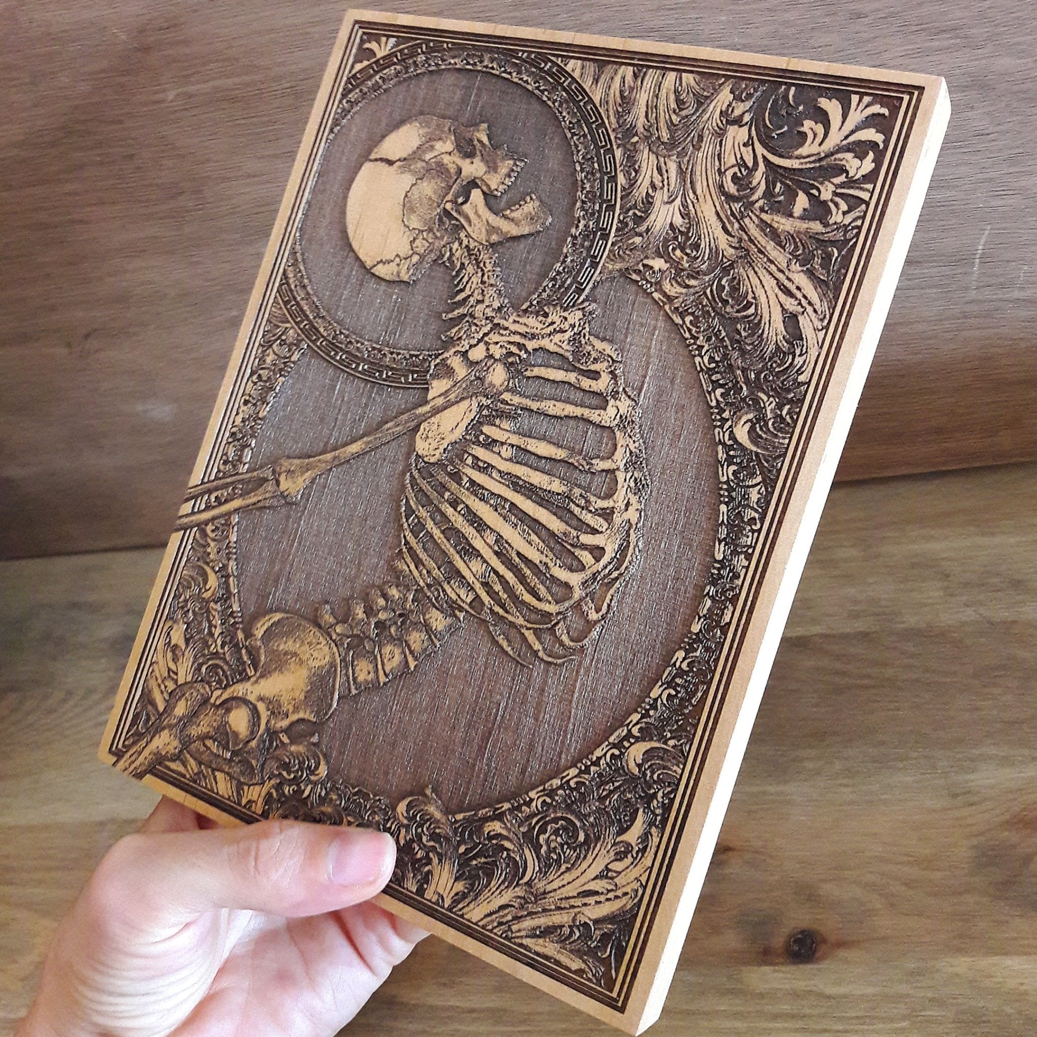 Gothic wooden skeleton wall art, handcrafted engraving perfect for dark fantasy decor and unique alternative gifts.