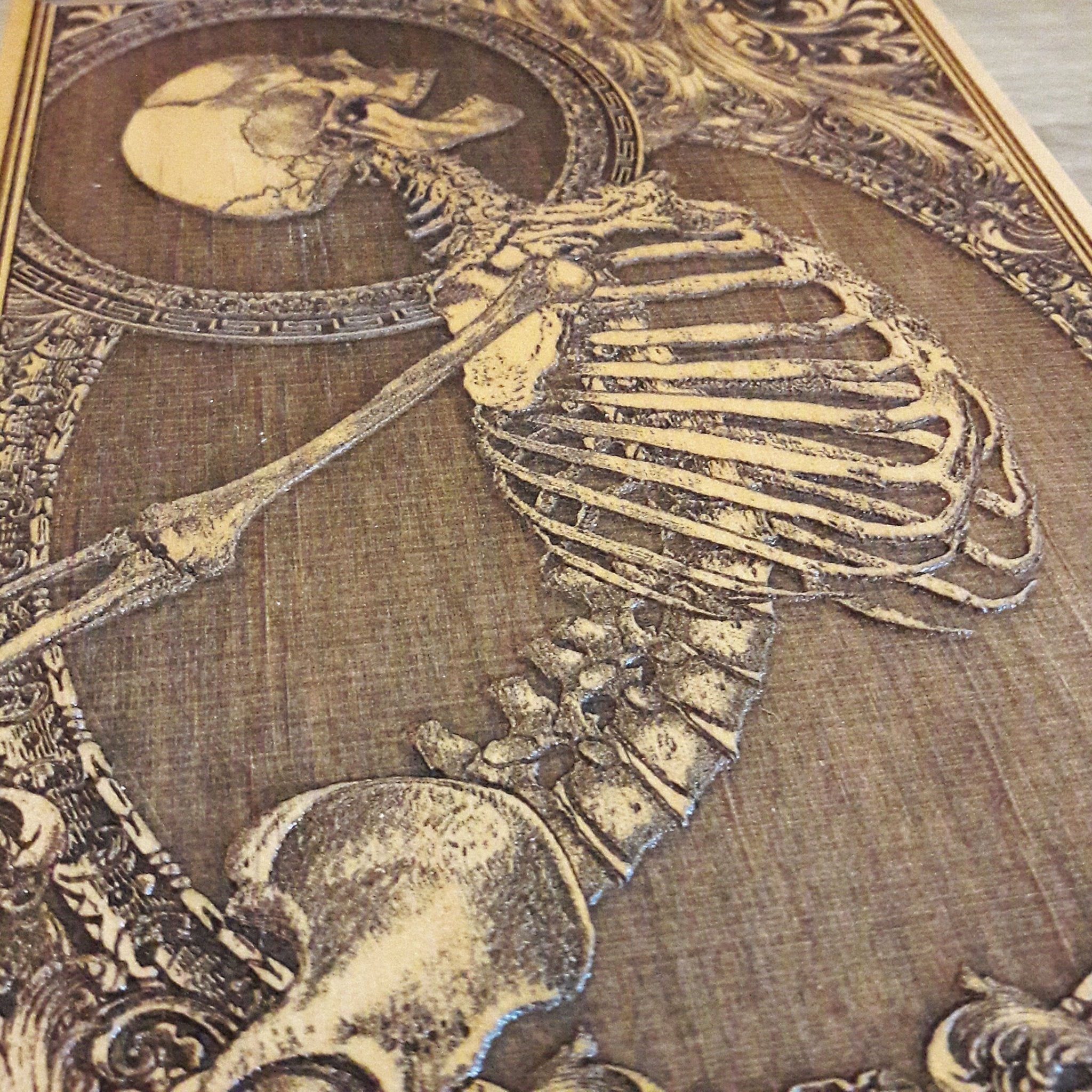 Engraved wood skeleton artwork, a macabre yet stylish piece for skull lovers, horror fans, and gothic interiors.