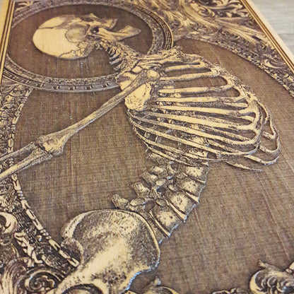 Engraved wood skeleton artwork, a macabre yet stylish piece for skull lovers, horror fans, and gothic interiors.