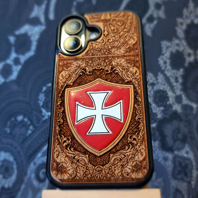 Deep laser engraved and hand painted wooden phone case featuring a medieval Templar cross design for iPhone and Samsung Galaxy models.