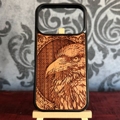Gothic raven wood phone case with realistic feather engraving on natural cherrywood