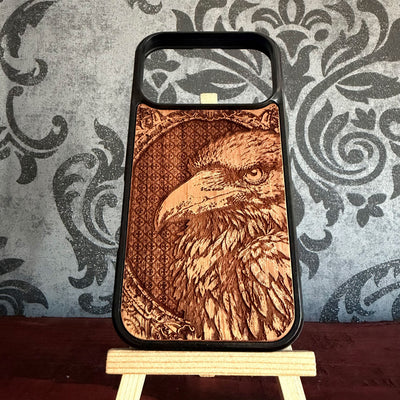 Realistic crow and raven artwork laser engraved on handcrafted cherrywood phone case