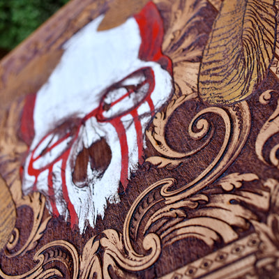 Occult wall decor featuring horned skull engraving