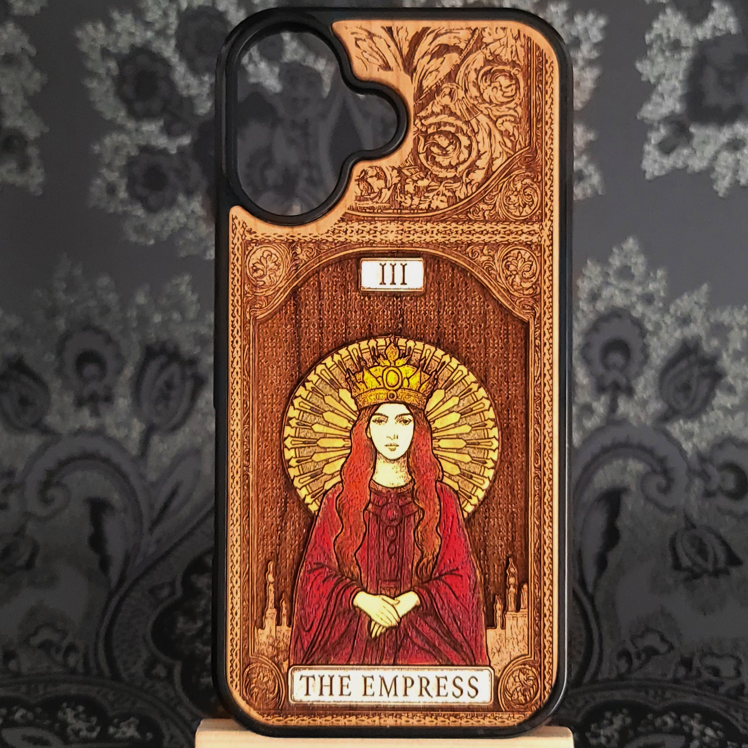 Deep laser engraved wooden phone case featuring The Empress tarot card with mystical celestial details on natural wood for iPhone and Samsung Galaxy models.