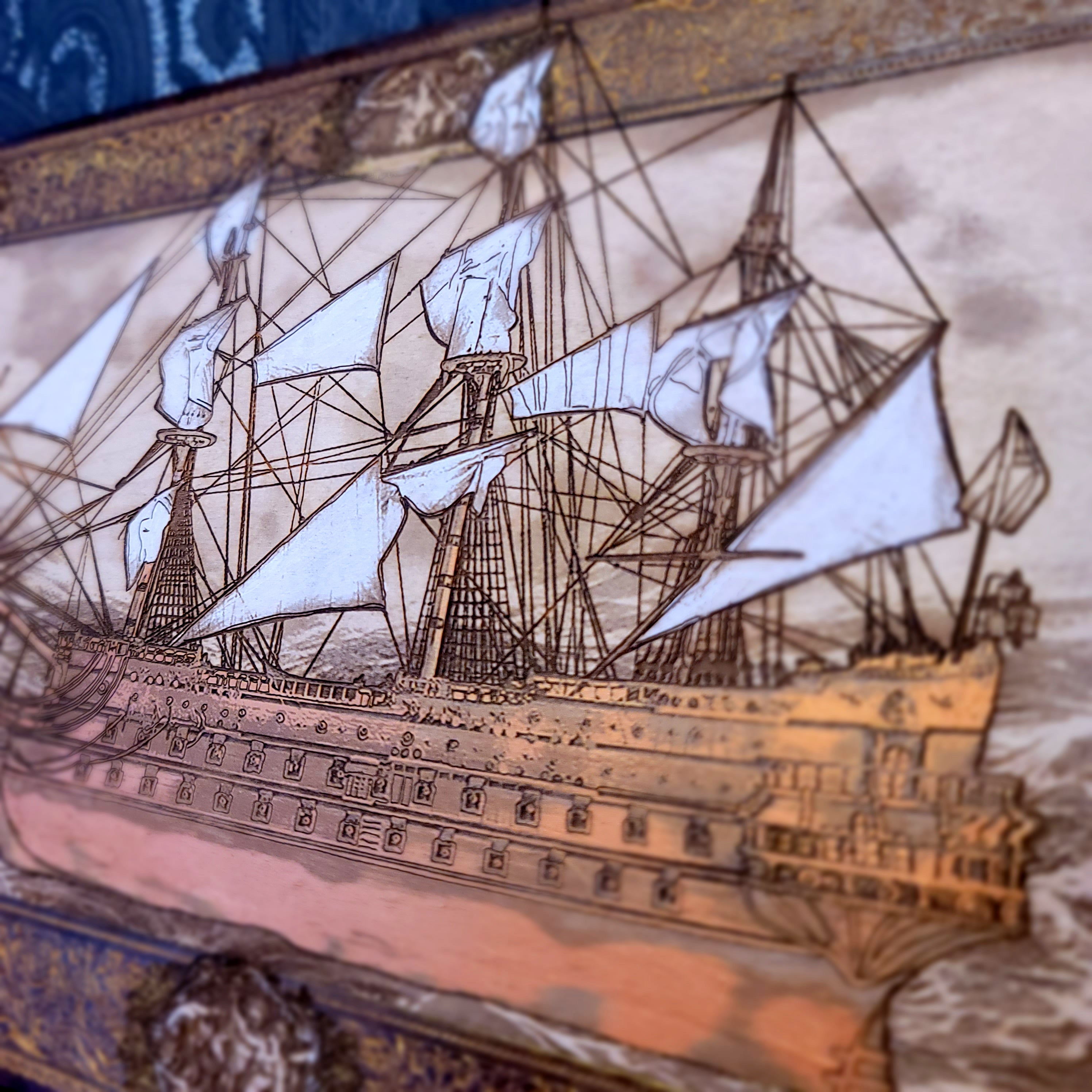 Decorative ship with intricate details on wood