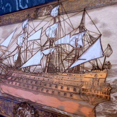 Decorative ship with intricate details on wood