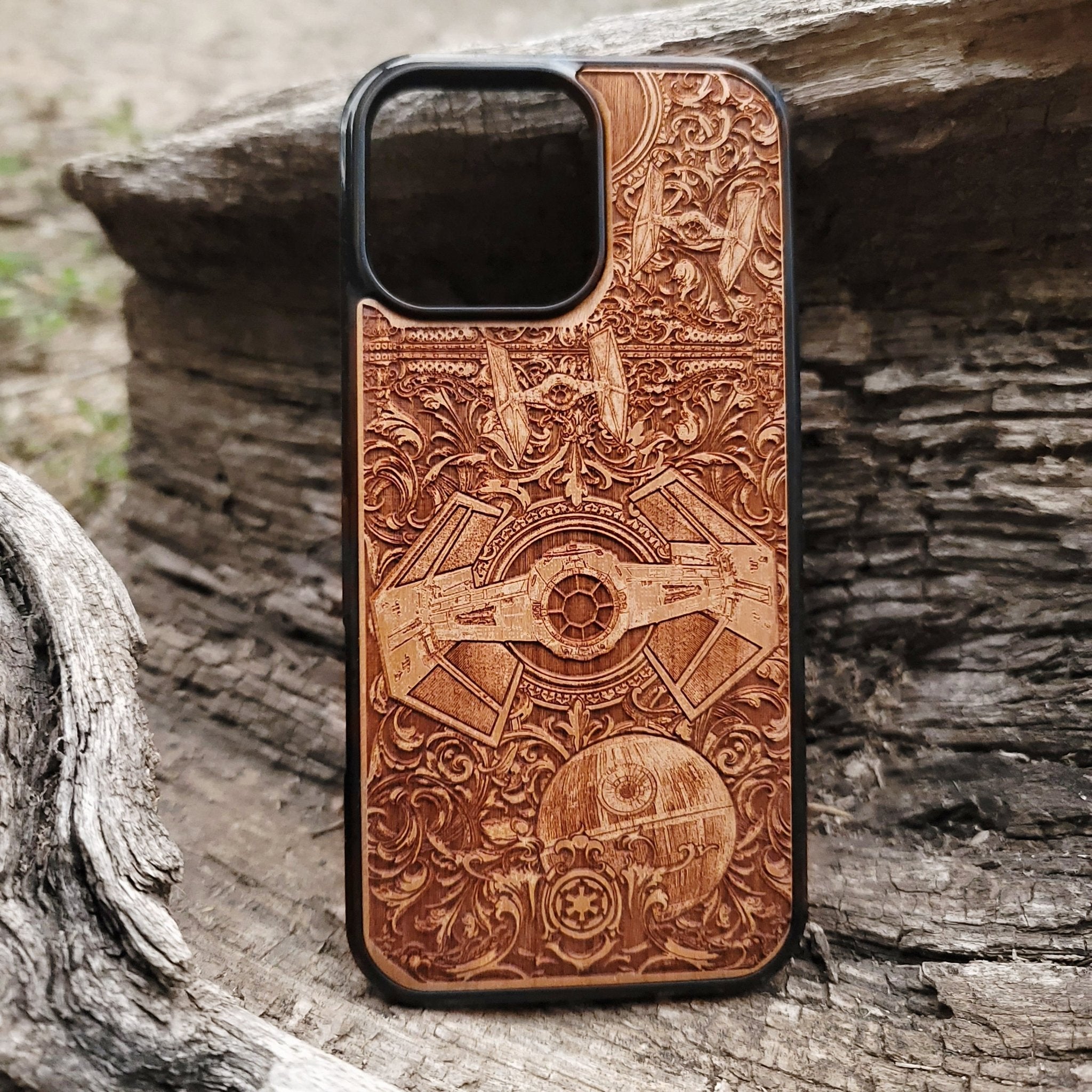 Star Wars wooden phone case with detailed TIE Fighter and Death Star carvings. Designed for iPhone  and Samsung Galaxy S, perfect for fans of the Star Wars saga looking for a unique and durable phone accessory.