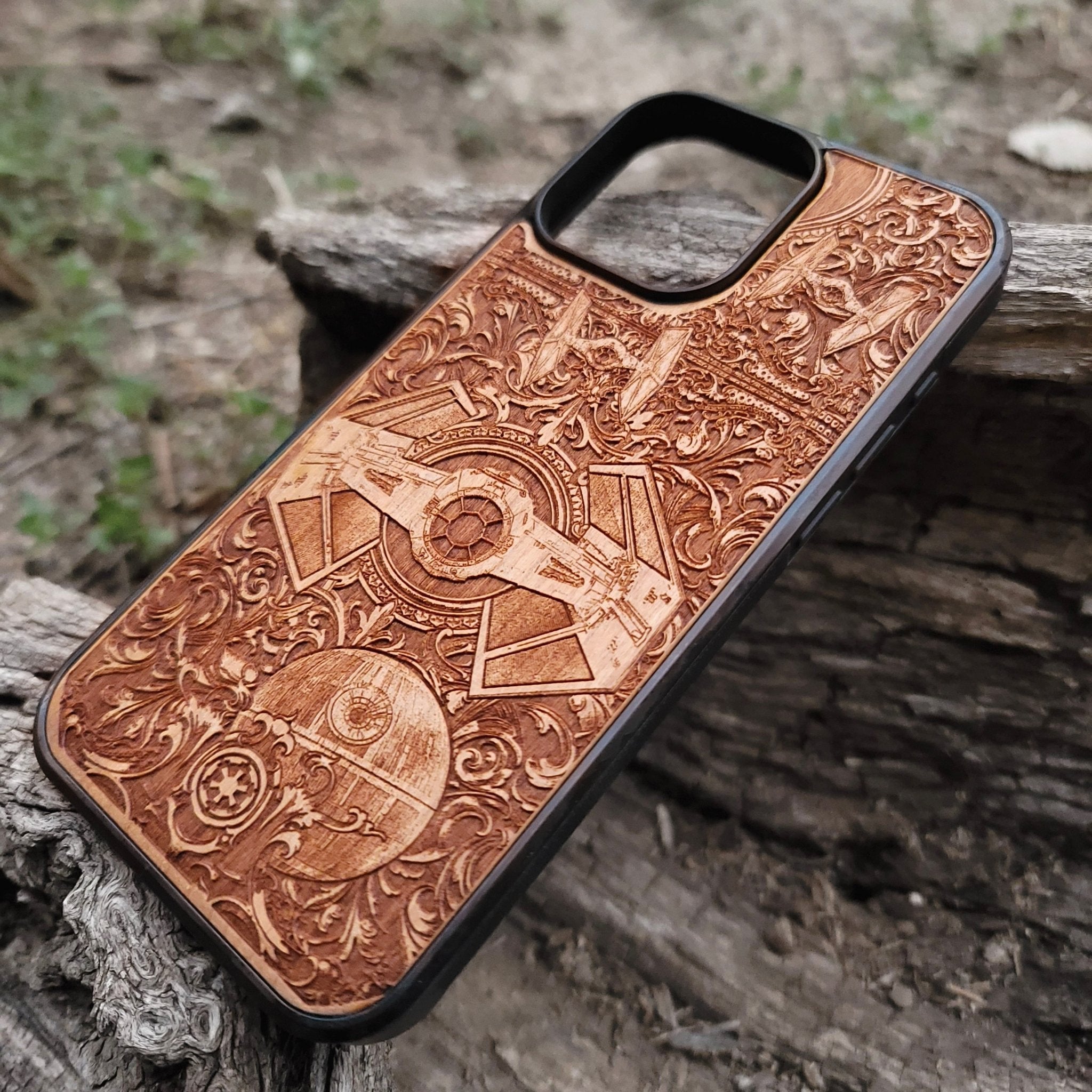 Star Wars wooden phone case with detailed TIE Fighter and Death Star carvings. Designed for iPhone  and Samsung Galaxy S, perfect for fans of the Star Wars saga looking for a unique and durable phone accessory.
