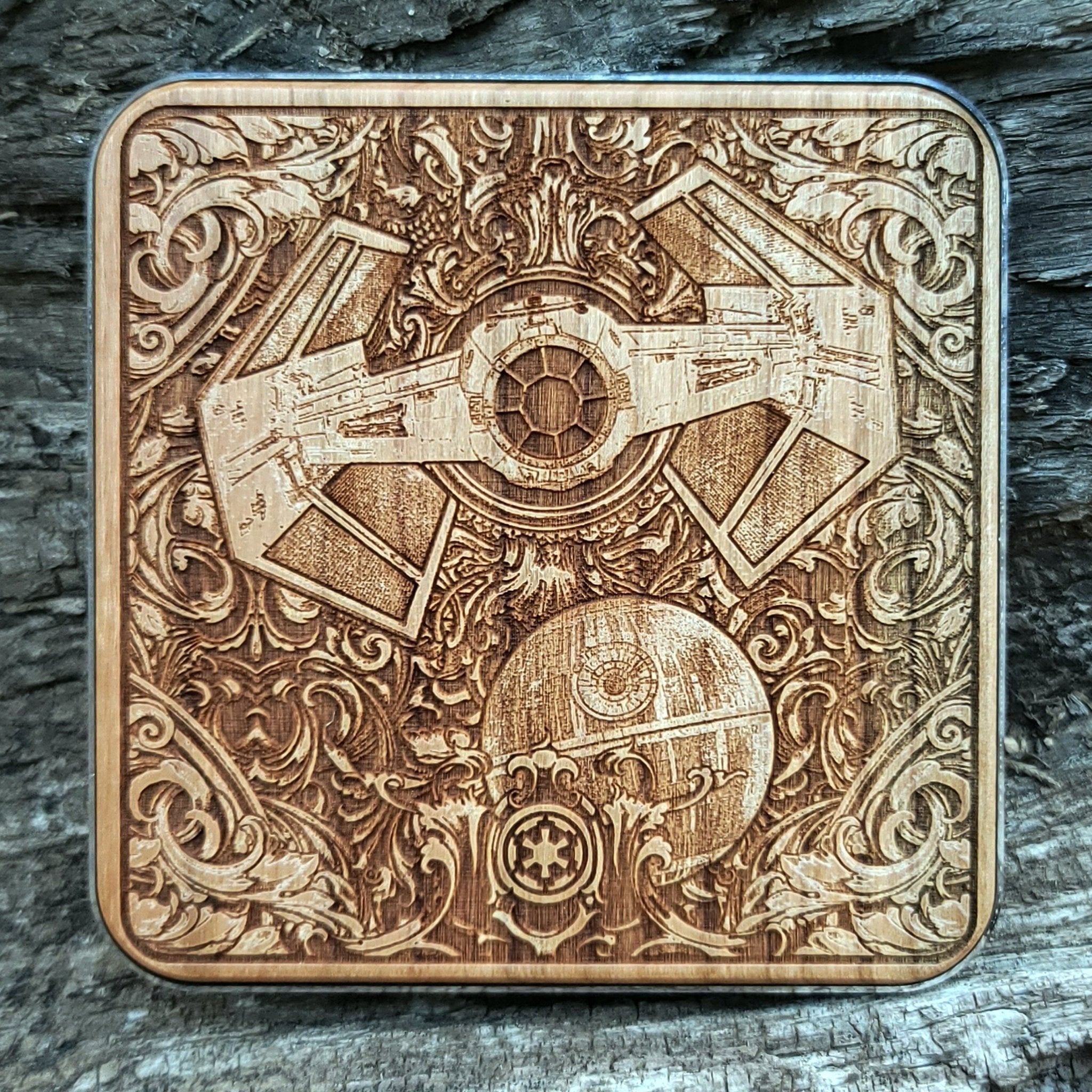 Handmade wood wireless charger with Star Wars-style spaceship engravings.