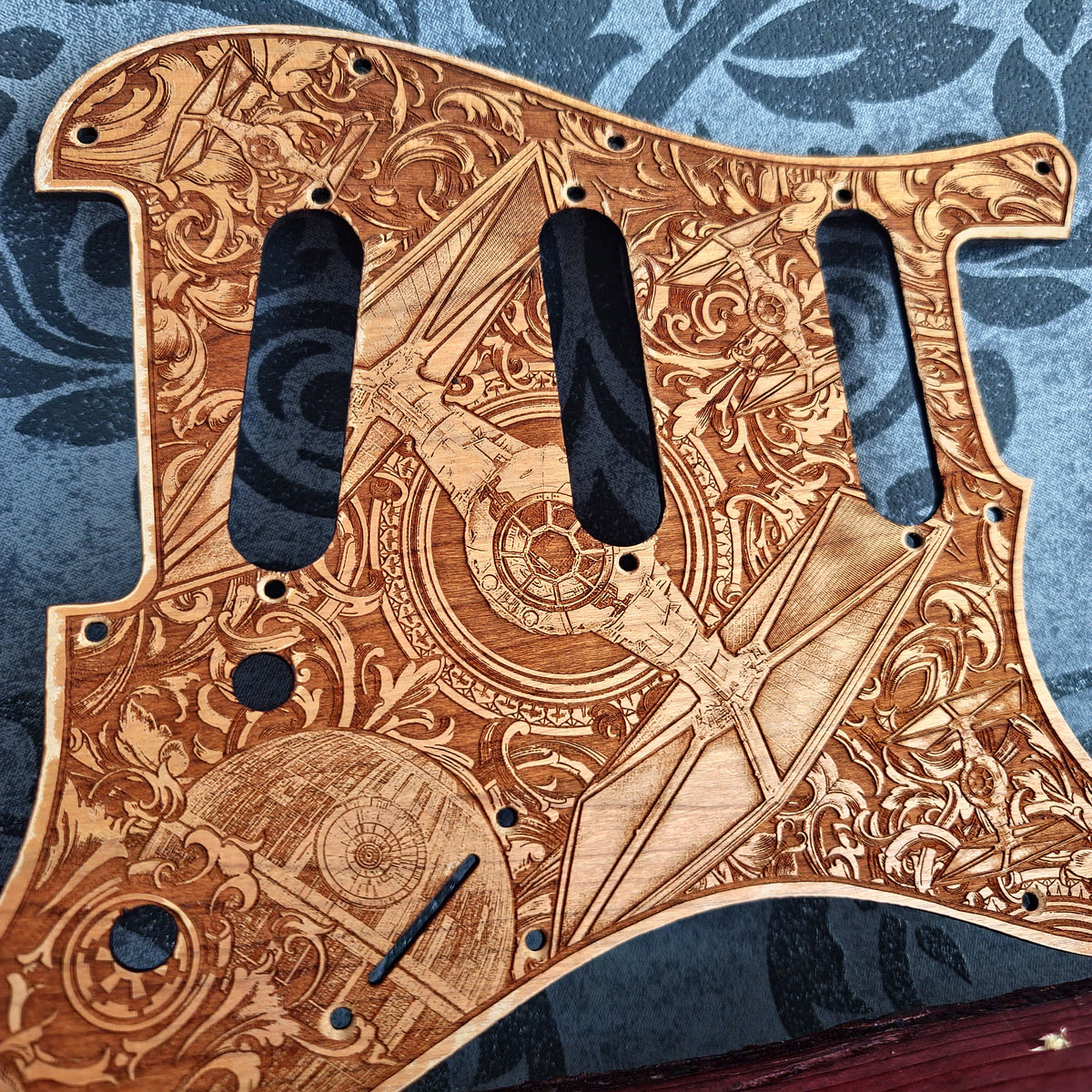 Personalized wooden bass pickguard with custom engraved artwork