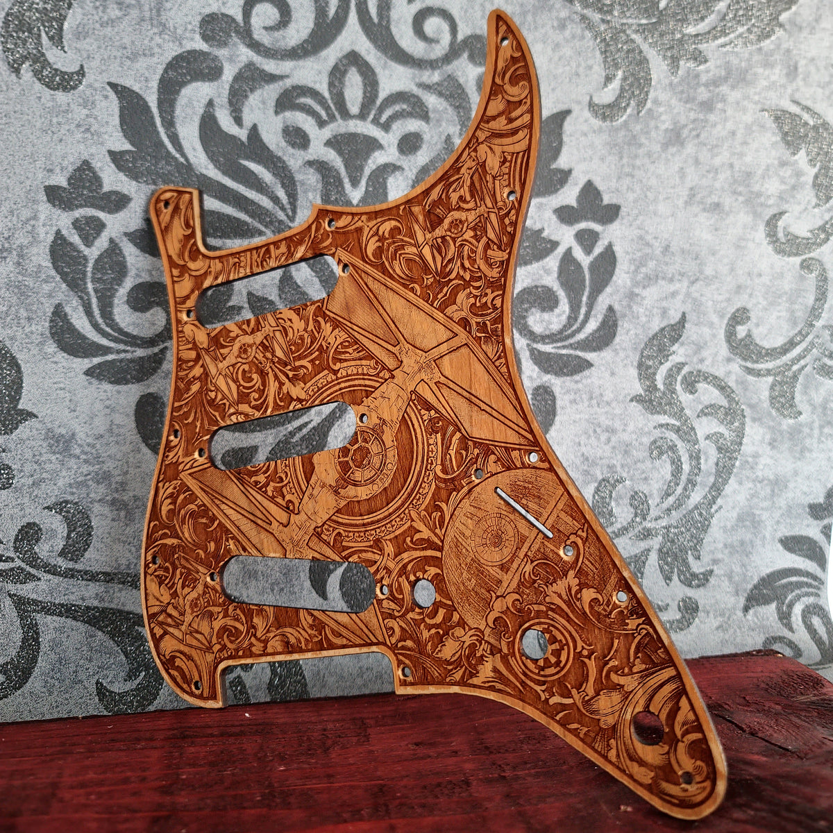 Custom Stratocaster style wooden pickguard with laser engraved artwork