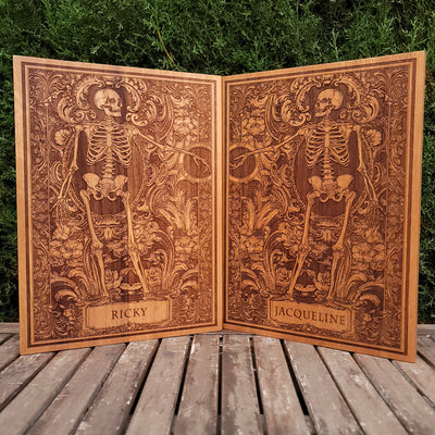 Engraved cedar wood skeleton couple artwork, personalized with names.
