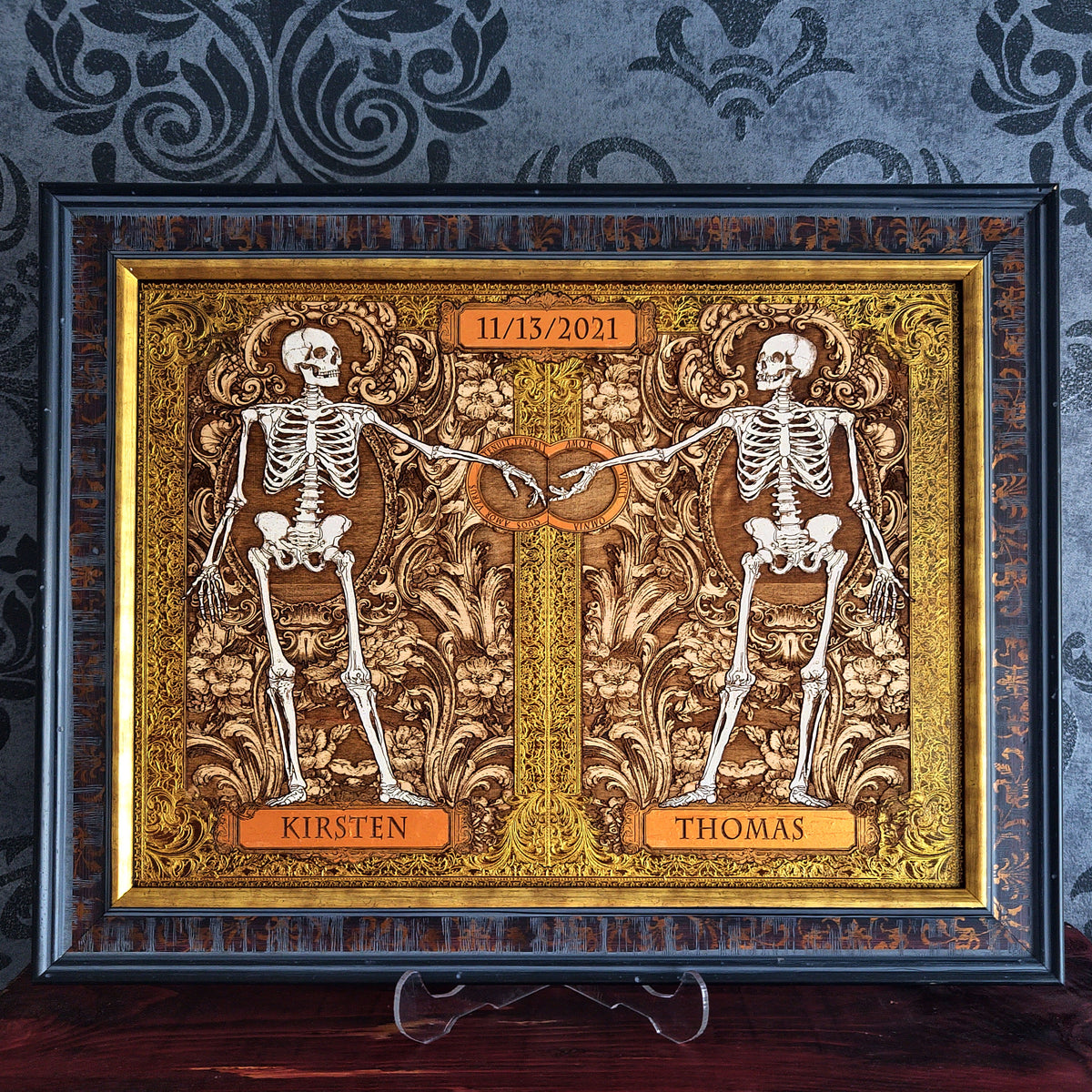 Gothic skeleton couple artwork with Amor Vincit Omnia Latin inscription