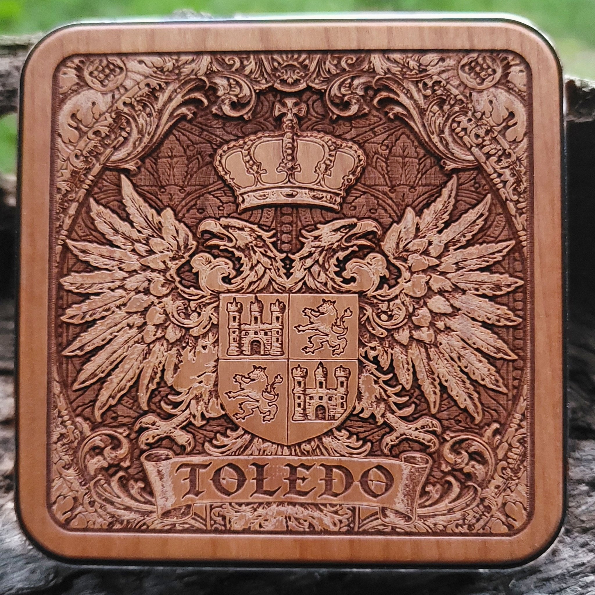 Laser-engraved Toledo coat of arms on wood wireless charger – customizable with your family name or message


