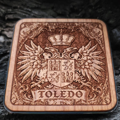 Laser-engraved Toledo coat of arms on wood wireless charger – customizable with your family name or message

