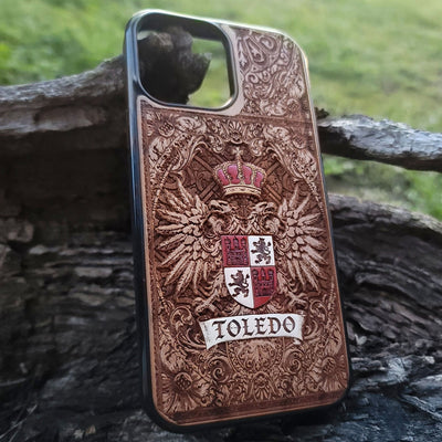 Wooden phone case with medieval-style Toledo family heraldry.